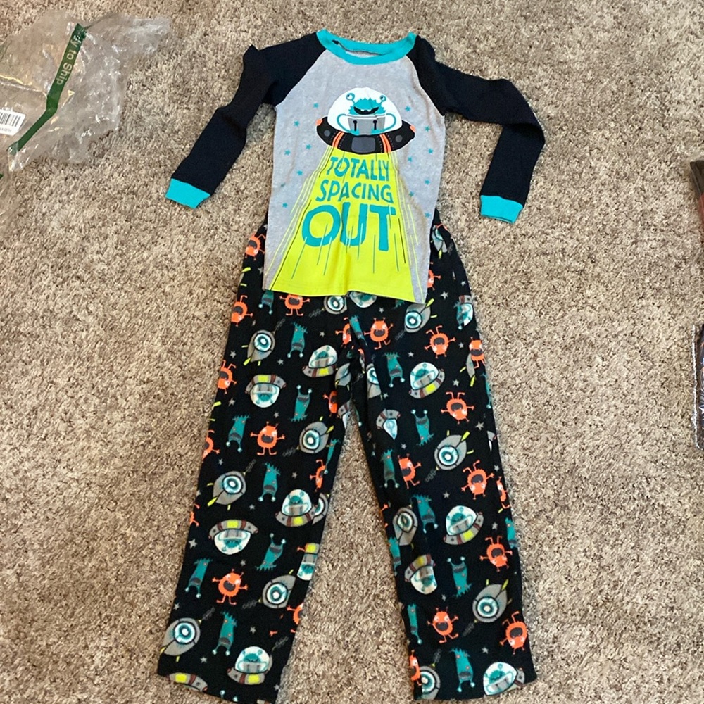 Boys pajamas. Space theme/flannel bottoms. Size7 by Carters. New.